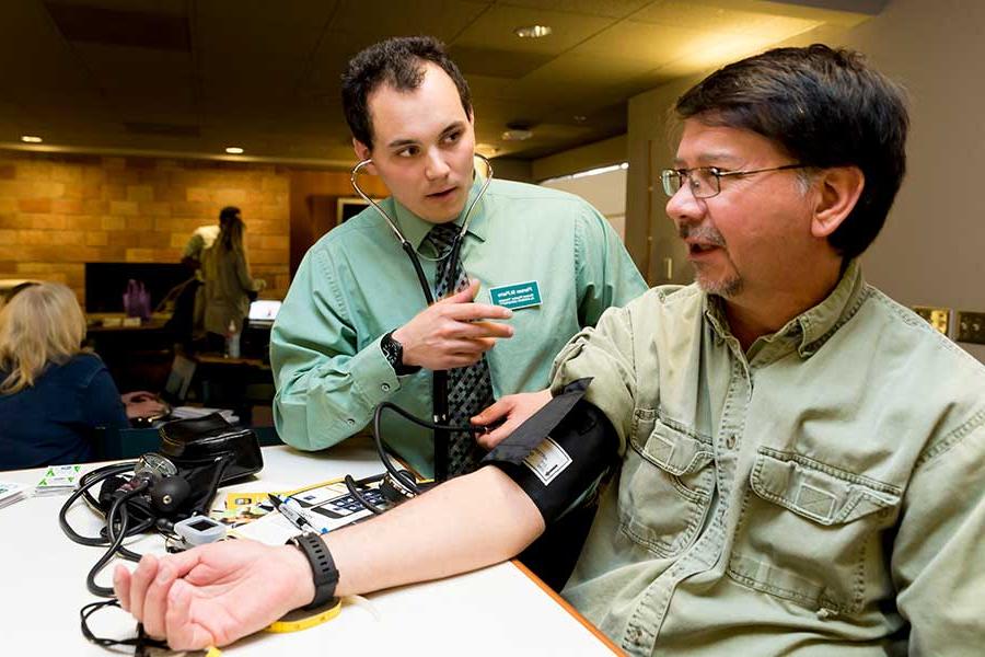 Employee having their blood pressure checked