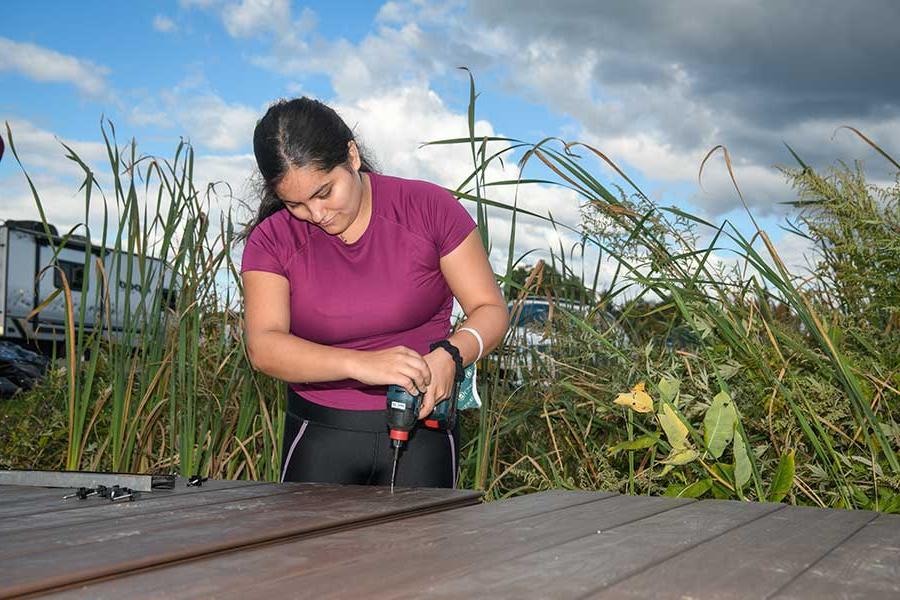 Student working on the timber bridge