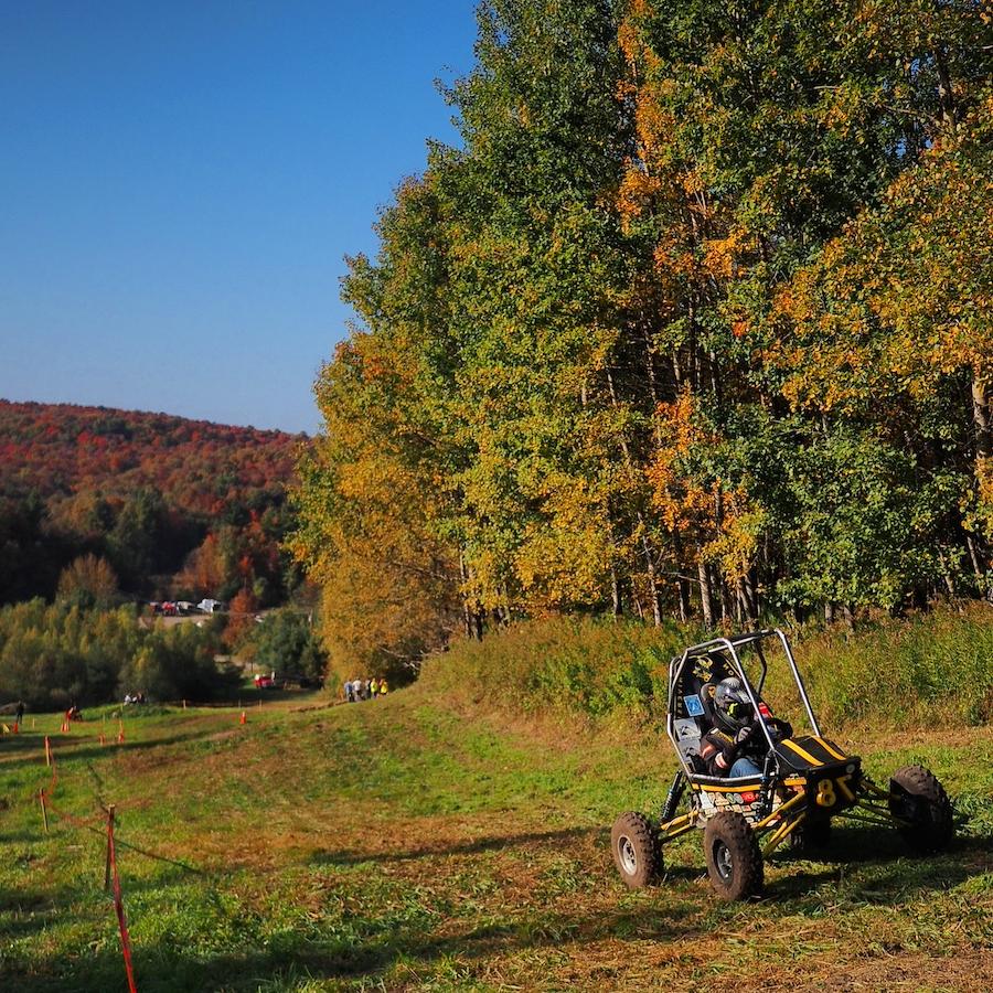 Baja SAE car outside at 7 springs in the fall color trees backdrop