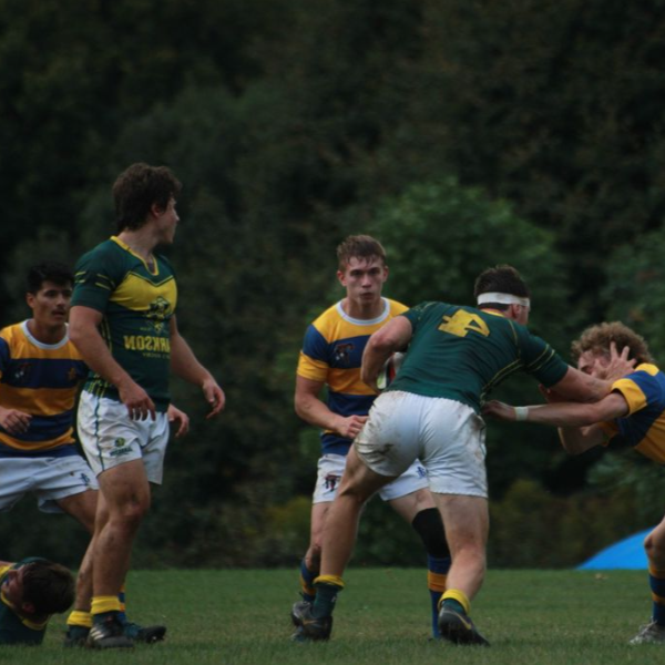 A photo of students on the men's rugby team during a game